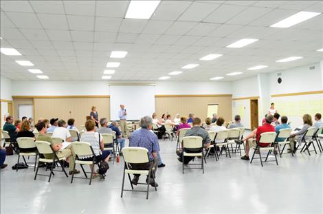 Community members discuss ways to improve the town.