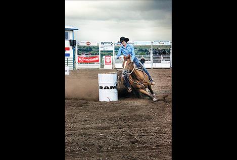 Nichole Lake rounds the first barrel, finishing with a time of 18.34.