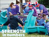 Volunteers assemble school playground