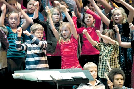 K. William Harvey Elementary students (front row, left to right) Tristen Mayfair, Girma Detwiler; (second row, left to right) Jasen Rodda, Chella Fuchs, Rylie Lindquist; (third row left to right) Isabela Larios, Hannah Rowe, Emma Lloyd and Haylie Webster dance to “Don’t Eat a Poinsettia” during the school’s Christmas concerts Dec. 14