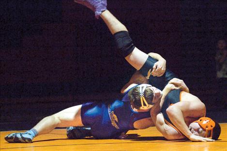Bulldog grappler Jacen Petersen turns a Flathead opponent on his head during a dual Dec. 11 in Ronan.