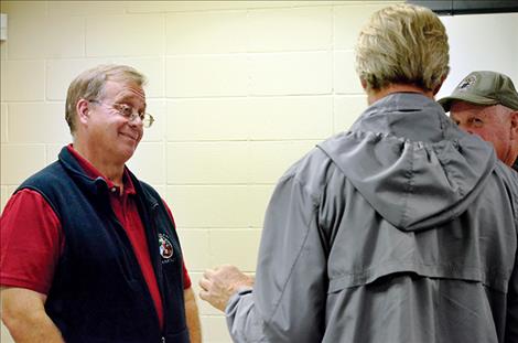 CSKT Fish Wildlife and Recreation Program Manager Tom McDonald talks with people about their concerns regarding the Bison Range Restoration Legislation.