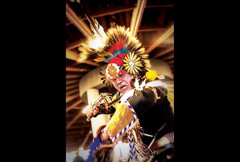 Rod First Strike competes in the Grass Dance at the Elmo Powwow.