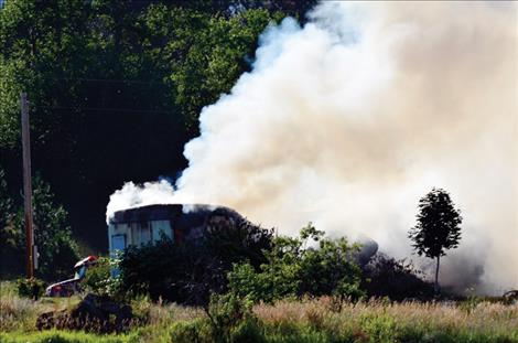 A trailer home in St. Ignatius burns Wednesday morning, July 20.