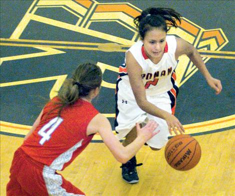 Angela North Piegan avoids a Loyola defender Dec. 18.