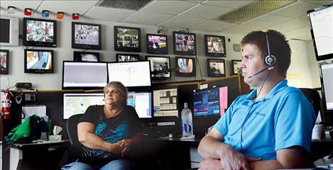 Dispatchers Anna Wright and Michael Hingiss work a shift together to answer emergency calls in the county. 