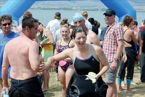 Ben Montgomery shares a laugh with race sponsorship coordinator Stacey Dunn after the swim.