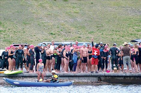 Swimmers listen to instruction prior to the start of Saturday's 1-mile Water Daze open-water swim.
