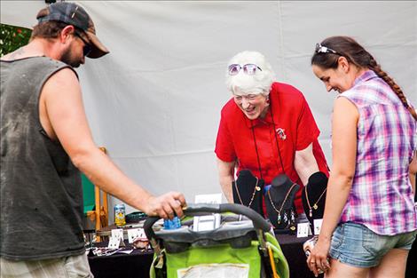 Local artist Joanne Simpson visits during the Sandpiper Art Festival.