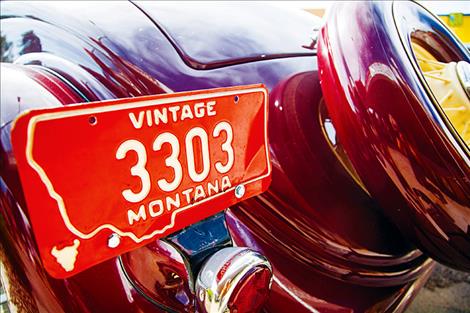 A vintage plate matches its1935 Ford Coupe.