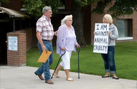 LDR Kennels owners Larry and Nadene Latzke leave the Lake County Courthouse after making their first appearance in Justice Court Wednesday, Aug. 10.