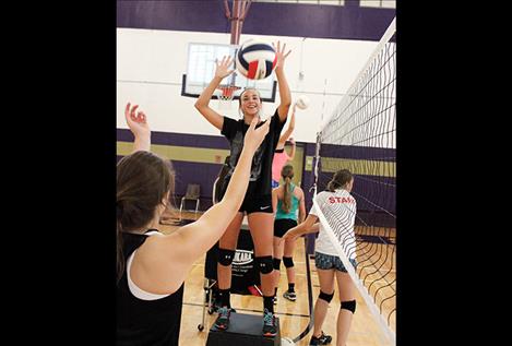 Lady Pirate Paige Noyes practice hitting the volleyball.