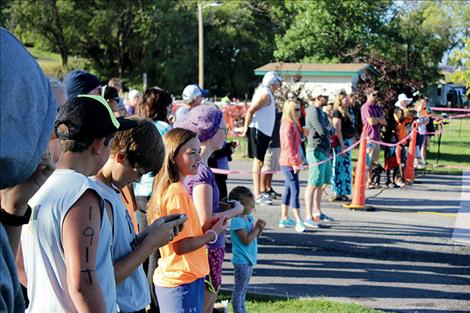 Female participants in Saturday’s Triathlon Race prepare for the 1.5 mile open water swim.