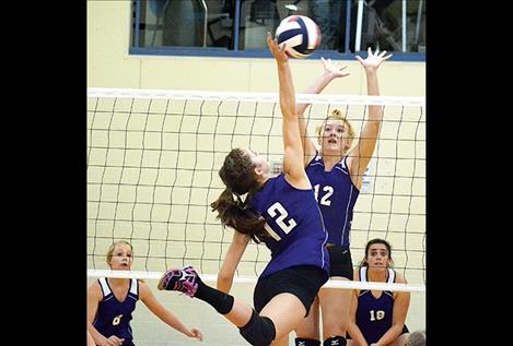 Charlo Lady Viking Cheyenne Nagy leaps to score a kill against Sheridan Lady Panther Janie Smart during Saturday’s Western C opening tournament in Drummond. The Vikings came in second place against 15 other teams, losing to Valley Christian in the championship game.