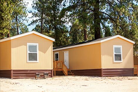 Fifteen new homes stand along U.S. Highway 93 in Pablo.