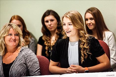 Polson High School senior Josey Motichka tells Governor Steve Bullock about her experiences as a student intern during his Aug. 31 visit.