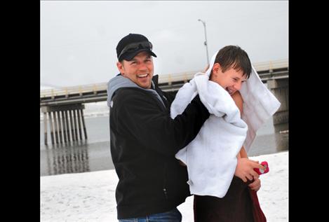Todd Fryberger towels off Brady Fryberger, his seventh grade son after the polar plunge on Jan. 1. Brady has plunged three years in a row.