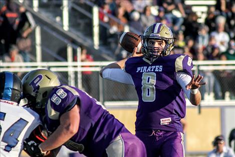 Pirate quarterback Tanner Wilson throws for 176 yards and rushed for 170 yards during Friday’s 47-14 win over the Corvallis Blue Devils.