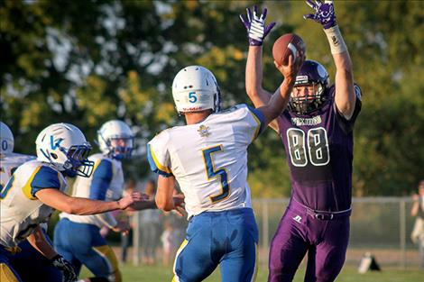 Charlo senior Kane Shenyer goes up to block a Pirate pass.