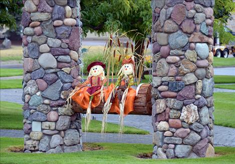 New wooden planters in downtown Ronan, above, and the Visitor Center along Highway 93, left, currently hold fall decor but will be donned with holiday cheer at Christmastime and support live foliage come spring.