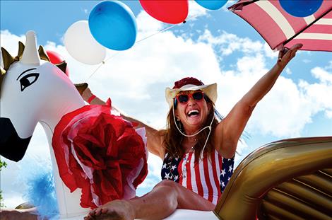 Nancy Riggio riles up patriotic spirit from atop a Pegasus in the Dayton Daze Parade.