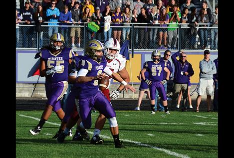 Polson quarterback Tanner Wilson looks for a receiver in a recent home game. Wilson leads the Northwestern A league in rushing, averaging 88 yards per game.
