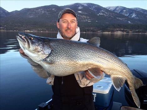 Bob Turner of Kalispell holds his large lake trout entry in 2015 Fall Mack Days.