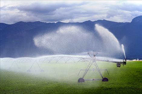 Irrigators water fields near Polson prior to Sept. 15, when general irrigation water was shut off. Some stockwater is still available in the Mission and Jocko Districts.