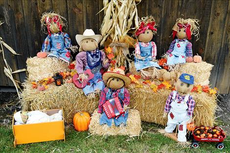 a family band of hay-stuffed folks created by Holly Lockwood take the prize in the scarecrow decorating contest.