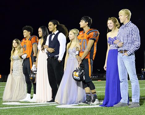 Ronan homecoming royalty await the crowning of Queen Rhylee Burland and King Tyler Houle, second couple from the right, during halftime of Friday’s 35-6 victory over Anaconda.