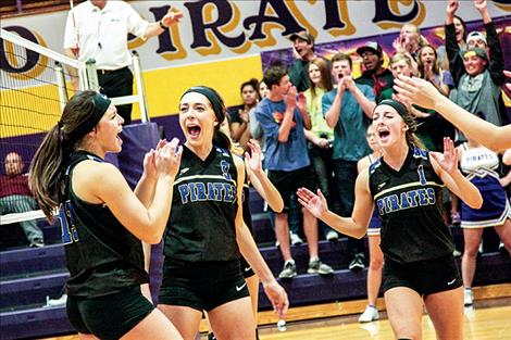 Lady Pirates celebrate a point during Saturday’s match against Dillon.