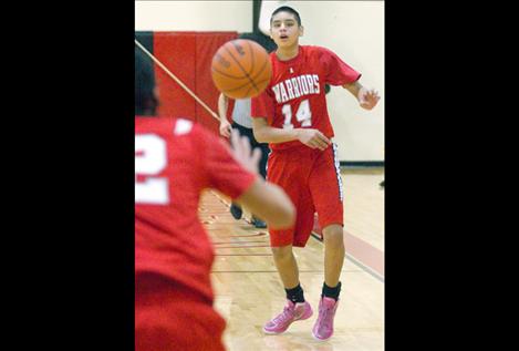 Aaron Fisher passes the ball to a teammate.