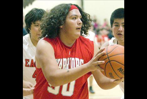 Isaac Camel looks for help as he is swarmed by Two Eagle players.