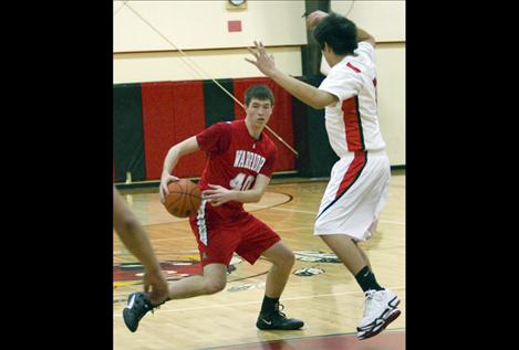 Josh Reed drives toward the basket.