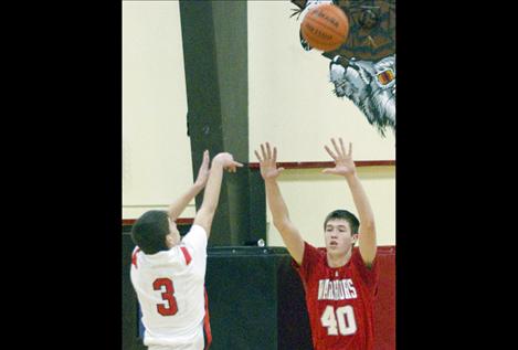 Josh Reed guards Two Eagle's Clayton Malatare.