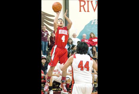 Sophomore PJ Haynes shoots  for three against the Eagles.