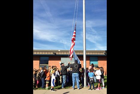 A new flag is raised at William K Harvey Elementary