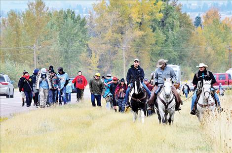 Bryce Finley, Leon Wieder and Austin Moran ride horses during the journey, like many people did during the original move to the Flathead Indian Reservation in 1891.