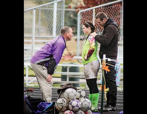 Coach Mike Hewston talks with Jenna Evertz before the shootout begins.