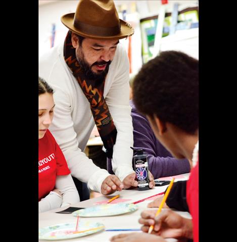 Artist Steven Paul Judd helps people understand the art project.