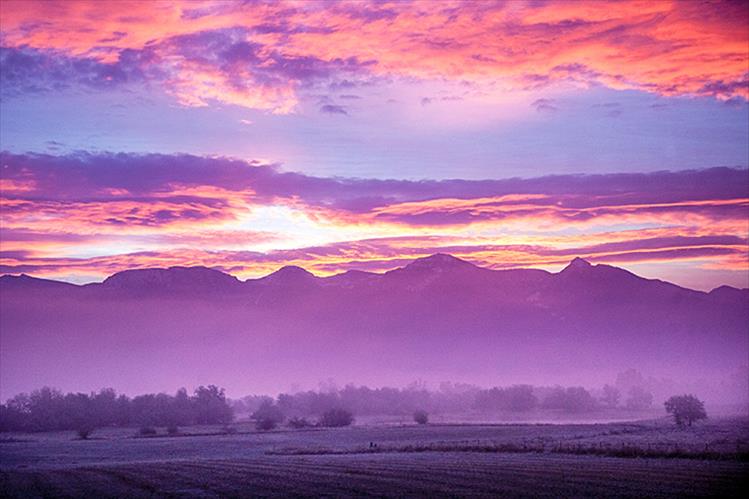 Fog welcomes the sunrise over Pablo Reservoir.