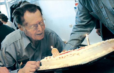 Orville Bjorge blows out the candles on his birthday cake. His nephew Marvin said he didn’t dare put 90 candles on the cake, so there was a “9” and a “0.”