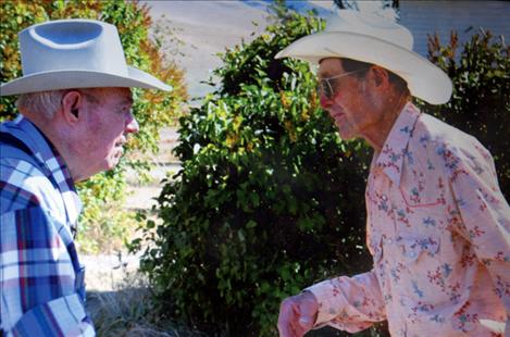 Morris Bjorge, left, and Orville Bjorge visit in earlier years. Morris has since passed away.