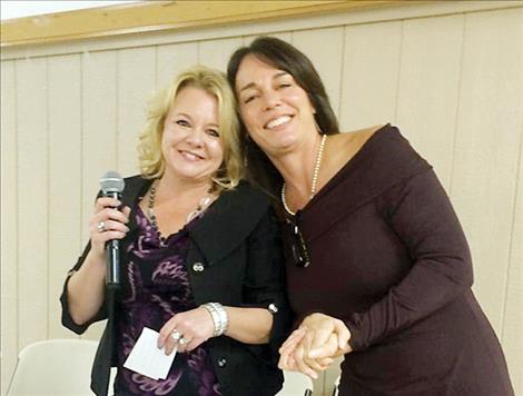 Launa Benson, left, helps DeeAnn Richardson, SAFE Harbor executive director, secure a Mary Kay $20,000 grant.