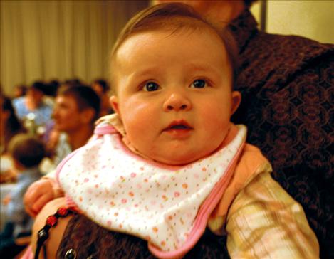 Halsey Middlemist, one of the youngest  attendees, hangs with her  grandmother  at the Western  Montana Stockgrowers Association winter meeting Jan. 19 in Polson.