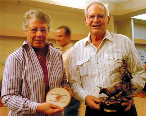 Delene and Roy Tufly display their lifetime achievement award,  a bronze,  at the Western Montana Stockgrowers Association annual meeting.  