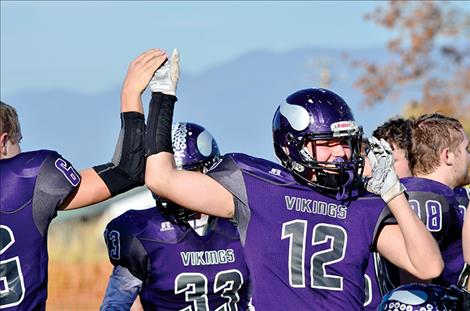 Brady Fryberger celebrates the Vikings’ win after Saturday’s game.