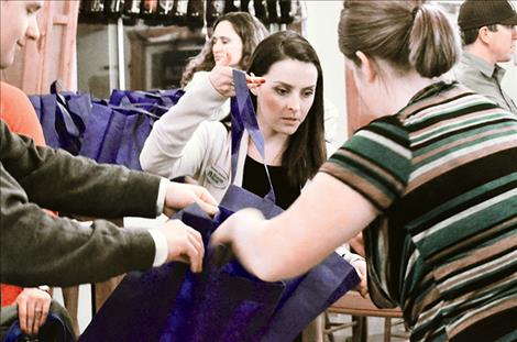Roxanne Duckworth organizes the bags filled with items people in need might use.