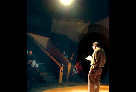  Dr. George  Price reads to a group gathered at the Johnny Arlee-Victor Charlo Theatre. Price spoke on African-American and Native American civil rights.