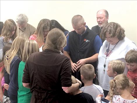 Pastor Jerry Roylance and students pray for Brian.